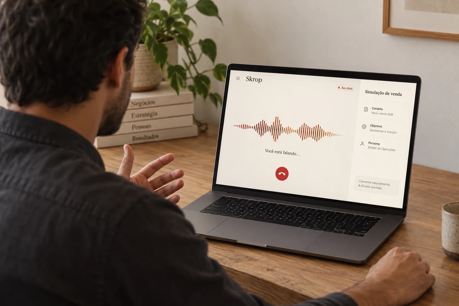 Salesperson seen from behind practicing a voice conversation with Skrop on a laptop.